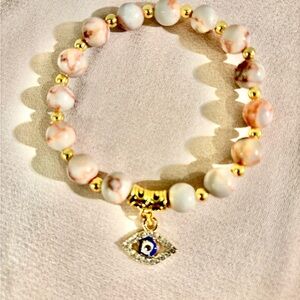 Gold and Cream Beaded Bracelet with Eye Charm